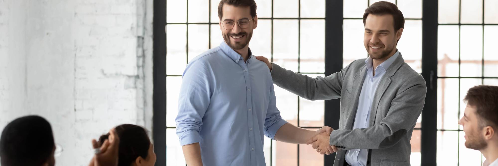 proud boss encouraging and thanking happy employee for good job