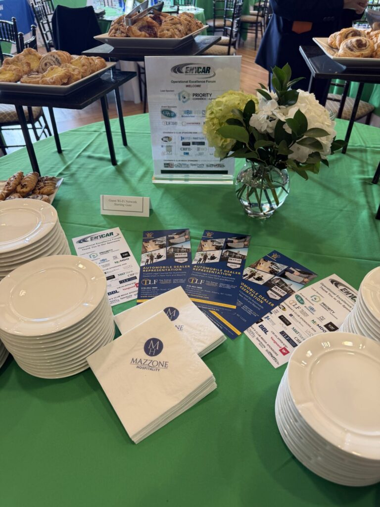 Breakfast setup with pastries and materials at ENYCAR Operational Excellence Forum